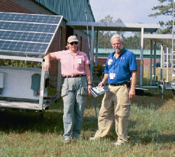 Picture of two men providing disaster assistance.