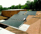 Picture of a uniquely mounted solar hot water system on a pool in North Florida.