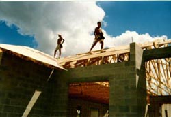 Picture of men working on roof.