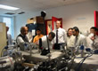 Picture of people looking at thin films equipment.