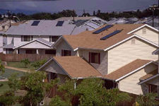 Picture of a home with a solar thermal system on the roof.