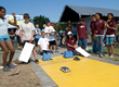 Participants at the Junior Solar Sprint at the starting line with their model cars.