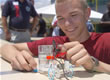 Picture of a student working with a fuel cell.