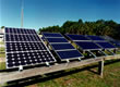 Picture of PV power control panels and inverter on a residence.