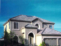 Picture of a home with a solar thermal system on the roof.