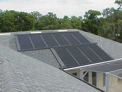 Picture of solar thermal collectors mounted on a residential roof.