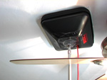 photo: pressure pan with pole covering vent next to ceiling fan