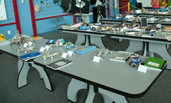 Photograph of judges inspecting model fuel-cell cars.