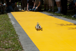 Photograph of official timing the model fuel-cell car.