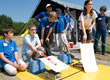 Picture of students at the starting line of the Junior Solar Sprint at the EnergyWhiz Olympics.