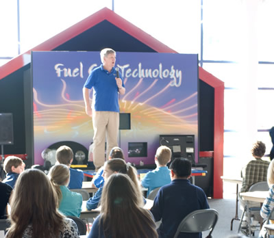 Photo of middle school teams at the tables for the elimination round.