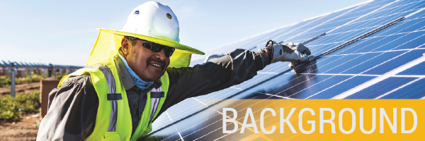 Solar installer leaning on phootvoltaic panels with the word Background in lower right corner.