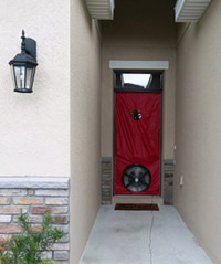 Blower door curtain installed in doorway at end of long entrance