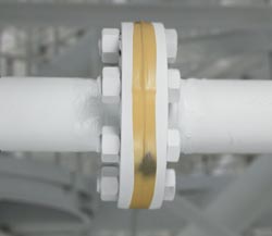 photo showing "smart paint" tape detecting hydrogen leak  around pipe flange