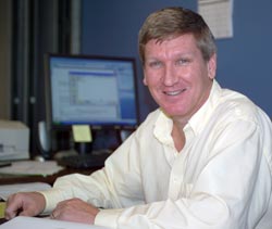 photo of Dr. James Fenton sitting at desk