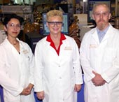photo of researchers in lab coat standing in lab