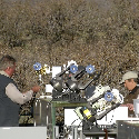 Photo of 2 people setting up equipment for calibration.
