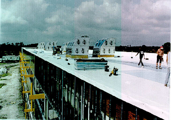Photo of workers on the roof of building under construction.