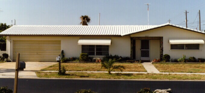 Photo of house with white roof