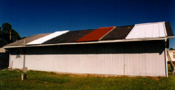 Photo of building with several different types of roofing materials.