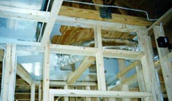 Picture of False beams below ceiling houses duct system in PVRES home.